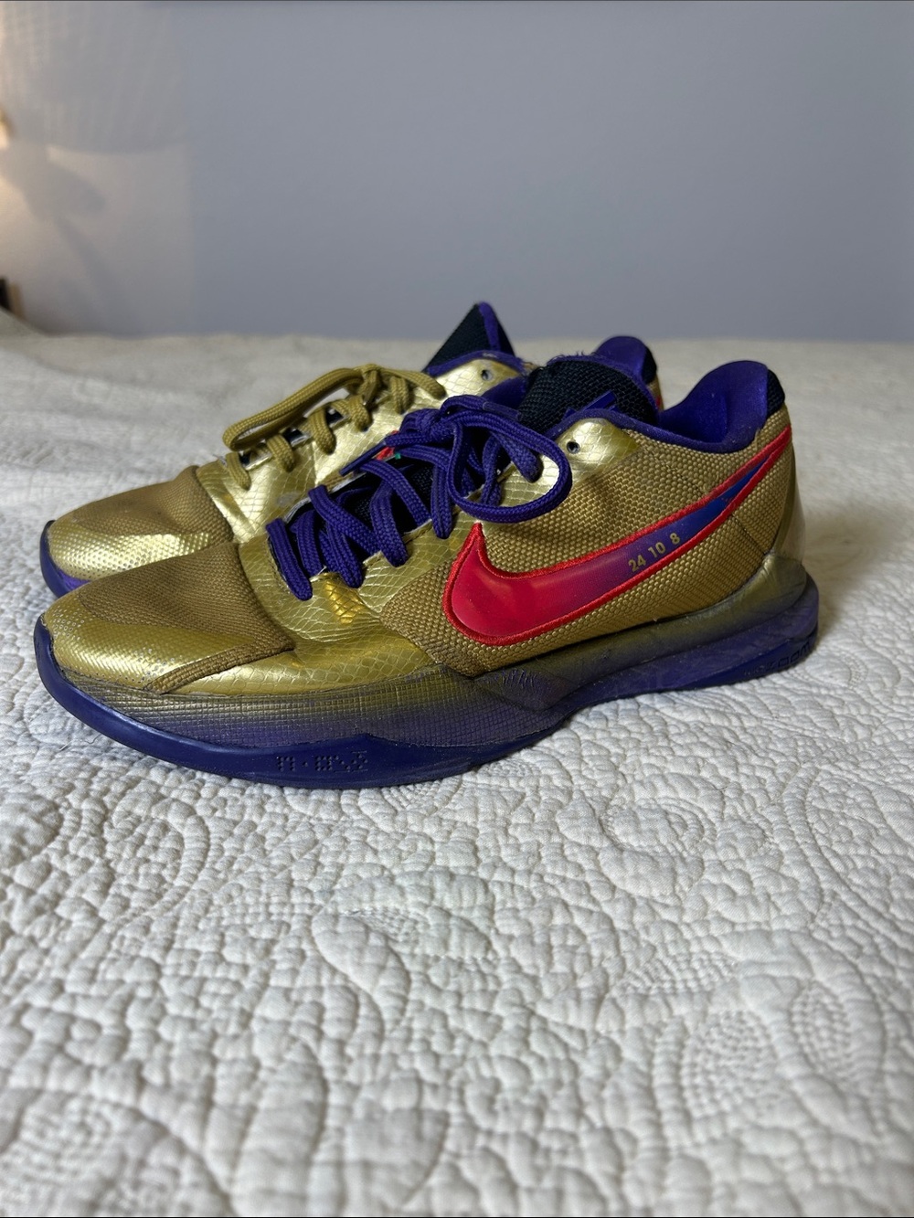 Nike Gold Athletic Sneakers with Red Swoosh and Purple Accents